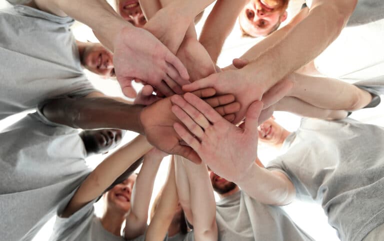 group,of,like minded,people,cupping,their,palms,together